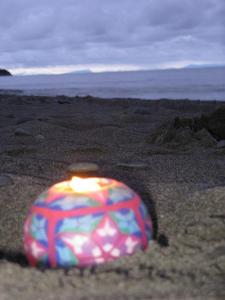 A memorial candle lit in honor of our daughter Jessie. This was lit by my niece Pam at a memorial service in Alaska honoring the infants and young children who have died in our family.