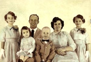 My family at my Aunt Sally and Uncle Bud's wedding. I was the flower girl. L to R: Charlotte, Me, Dad (Emory), Frank, Mom (Jean), Gayla